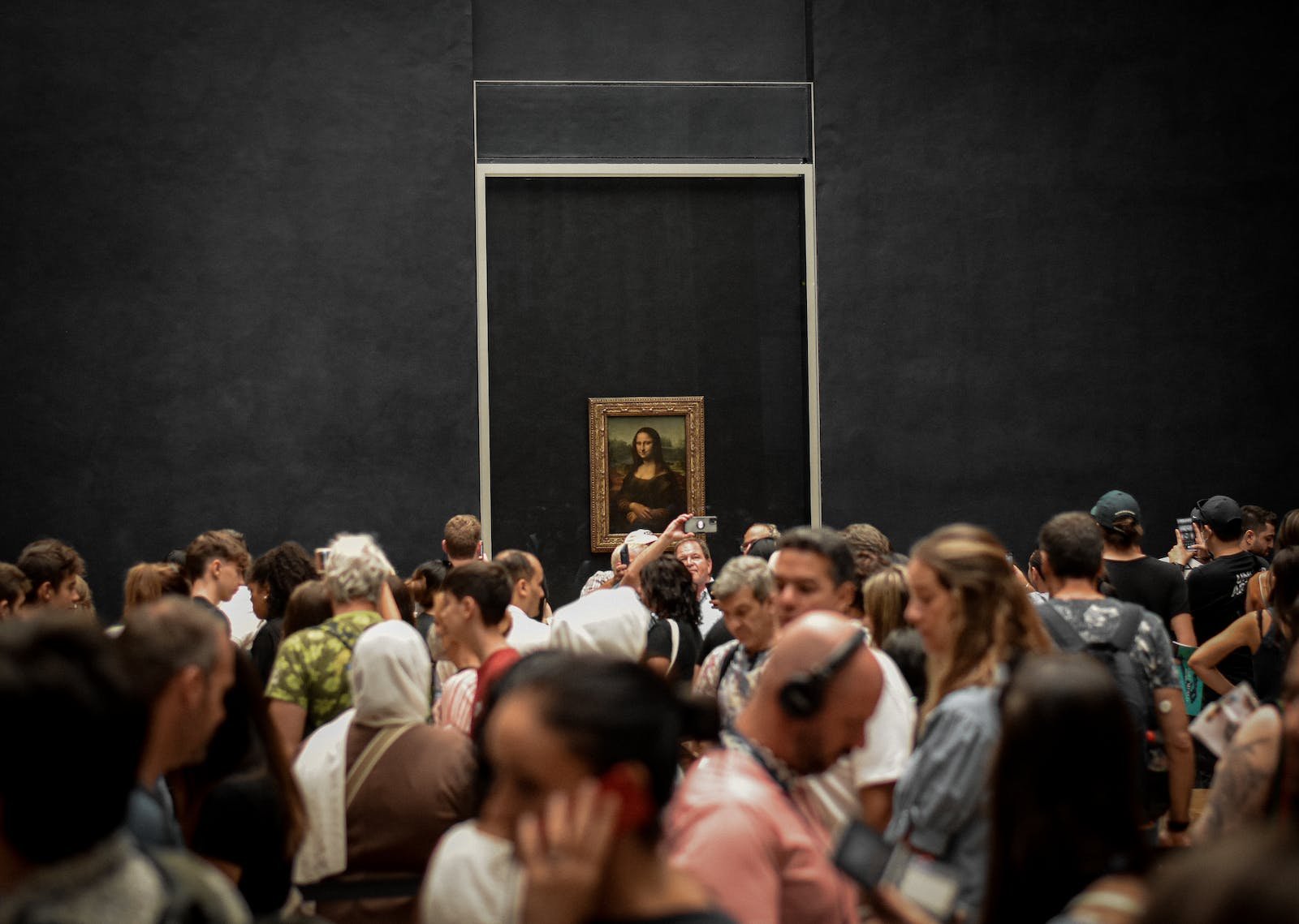 Crowd of Visitors in front of Mona Lisa Painting in the Louvre
