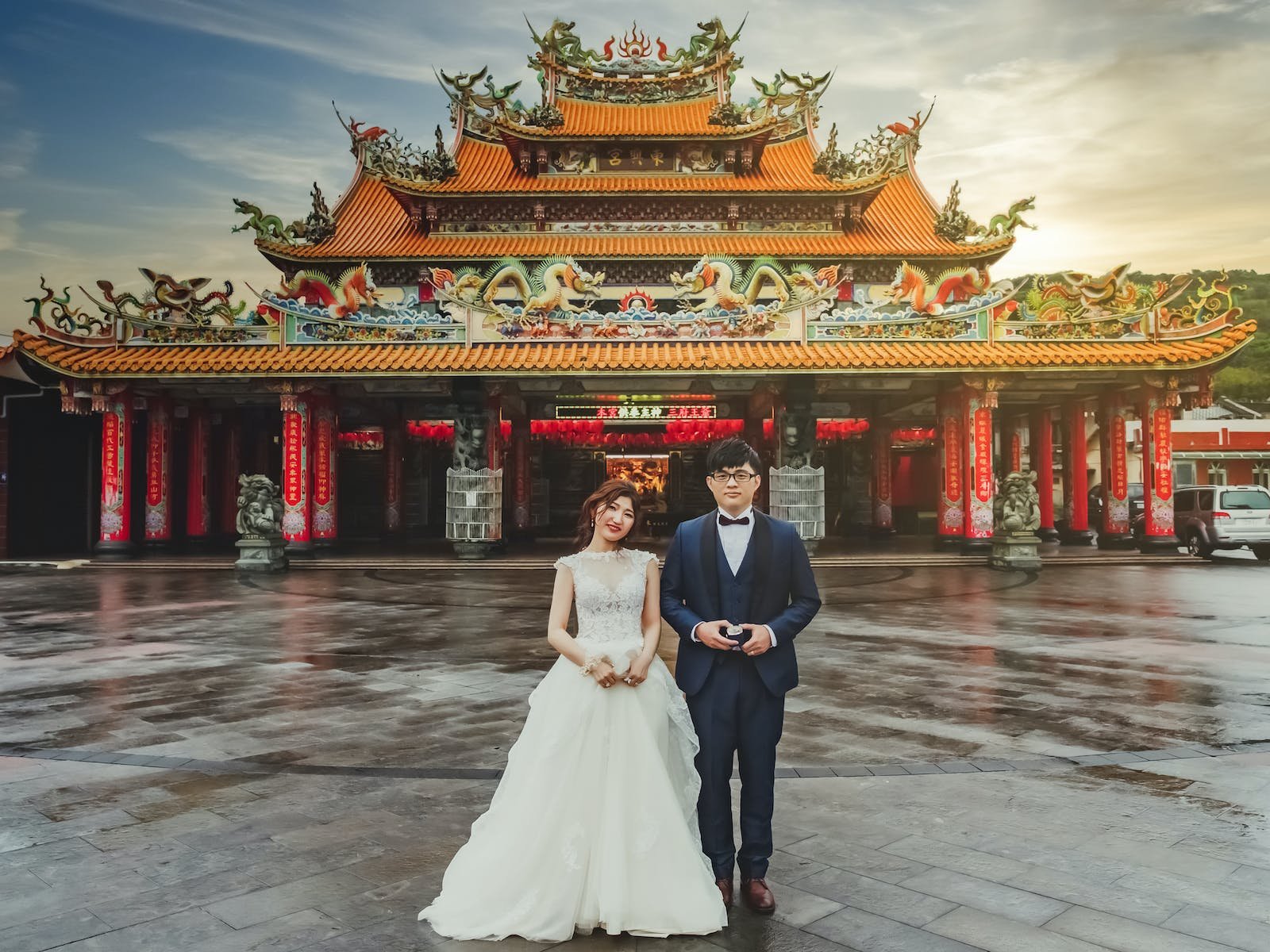 A Bride and Groom Standing in Front of the Temple